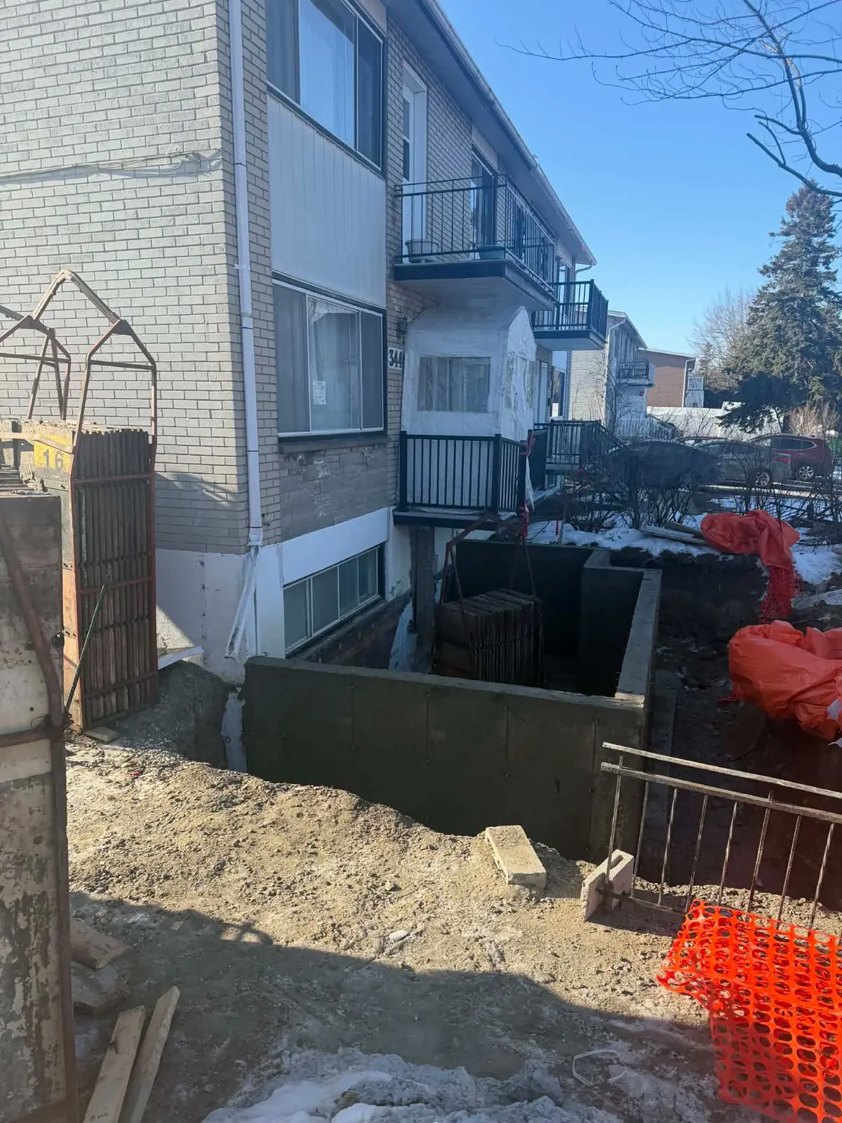Excavation et murs coulés sous un triplex